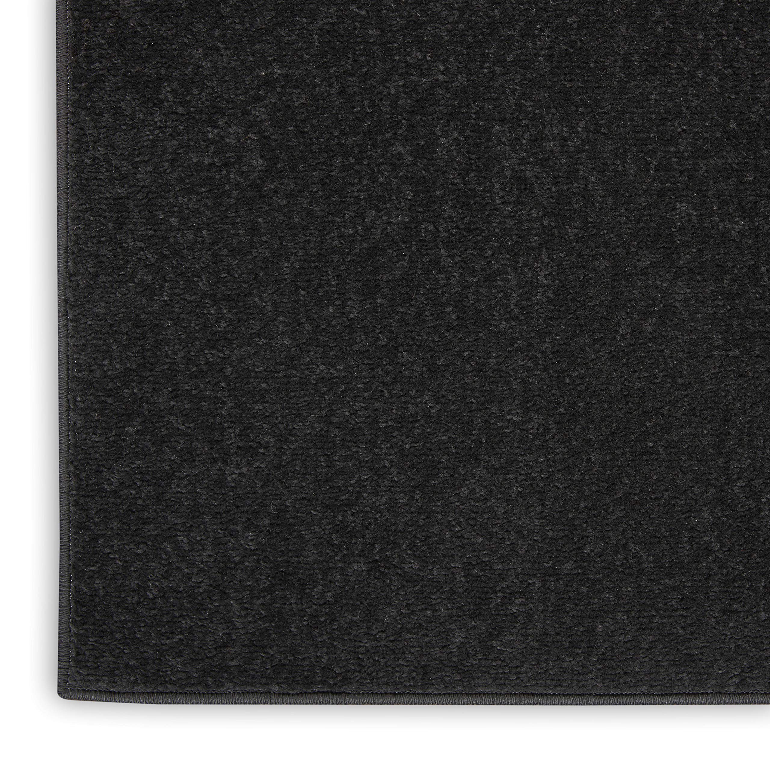 Nourison Essentials Black indoor-outdoor rug adapts from porch to living room.