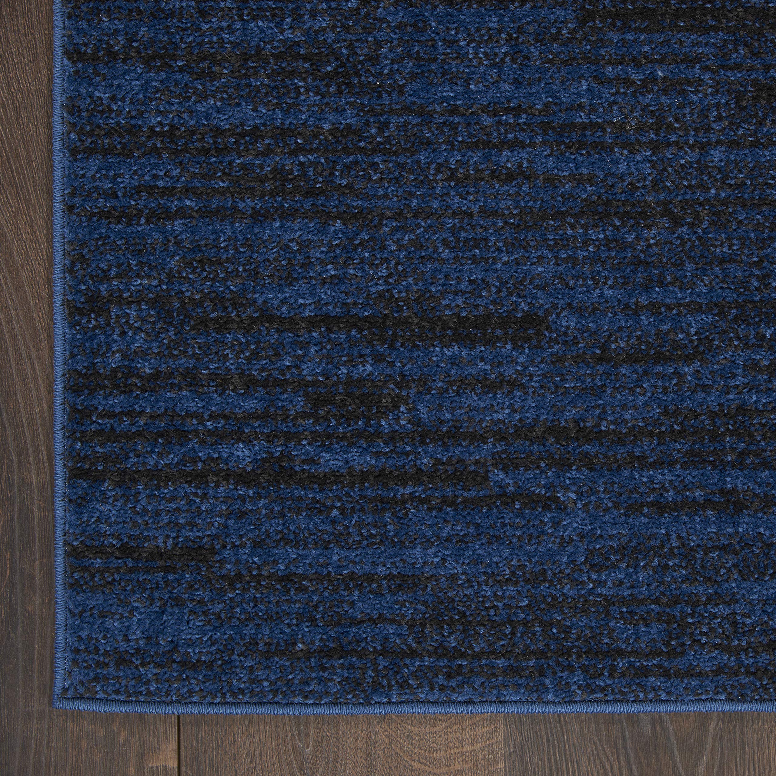 Nourison Essentials Midnight Blue rug in a dining room area