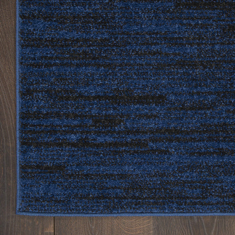 Nourison Essentials Midnight Blue rug in a dining room area