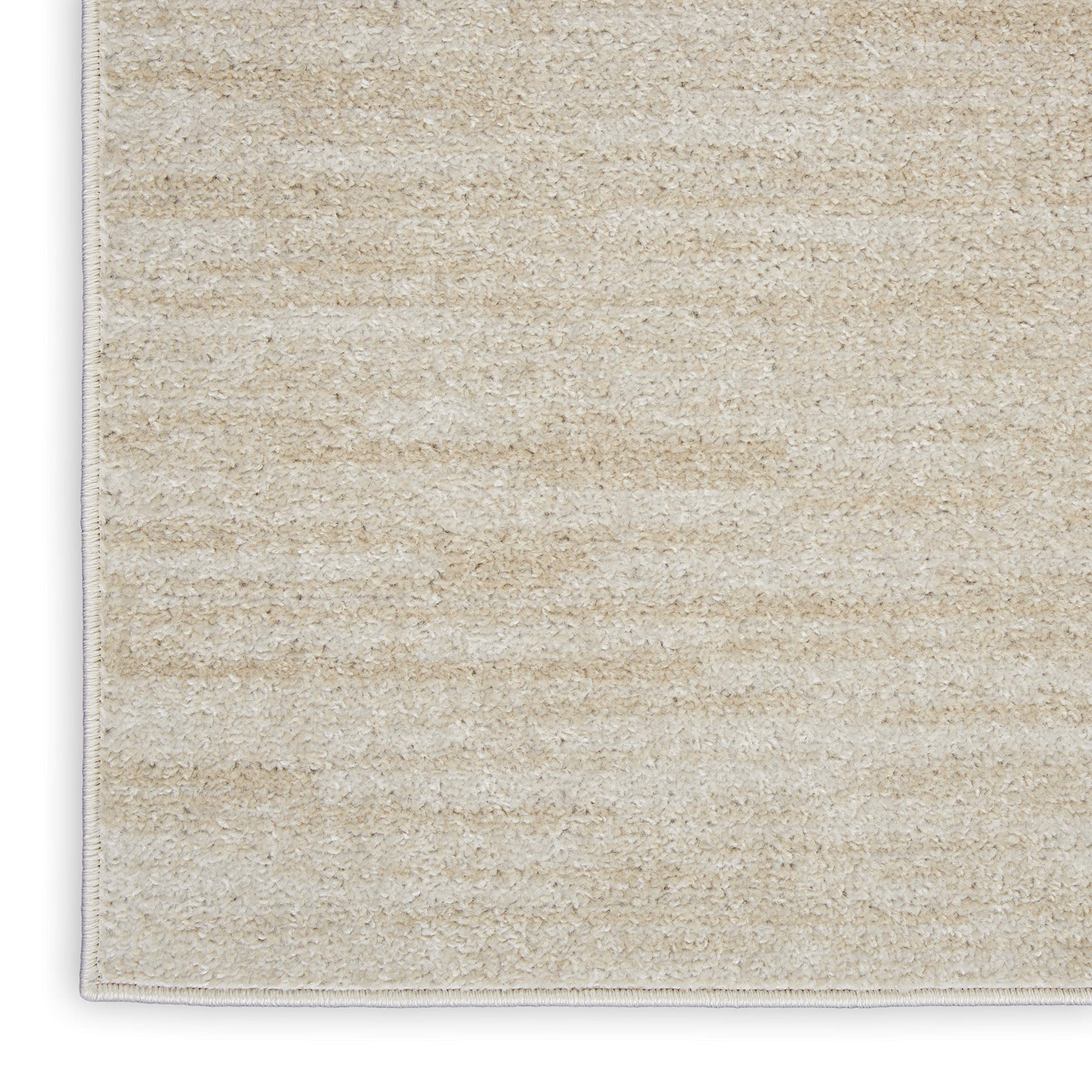Nourison Essentials Ivory Beige 7x10 Rug serged edge detail for a clean finish