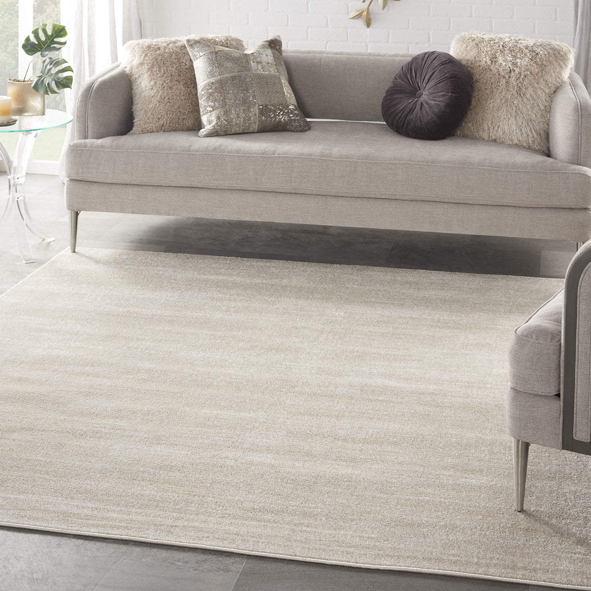 Nourison Essentials ivory beige 7x7 rug, angle view, versatile for indoor spaces