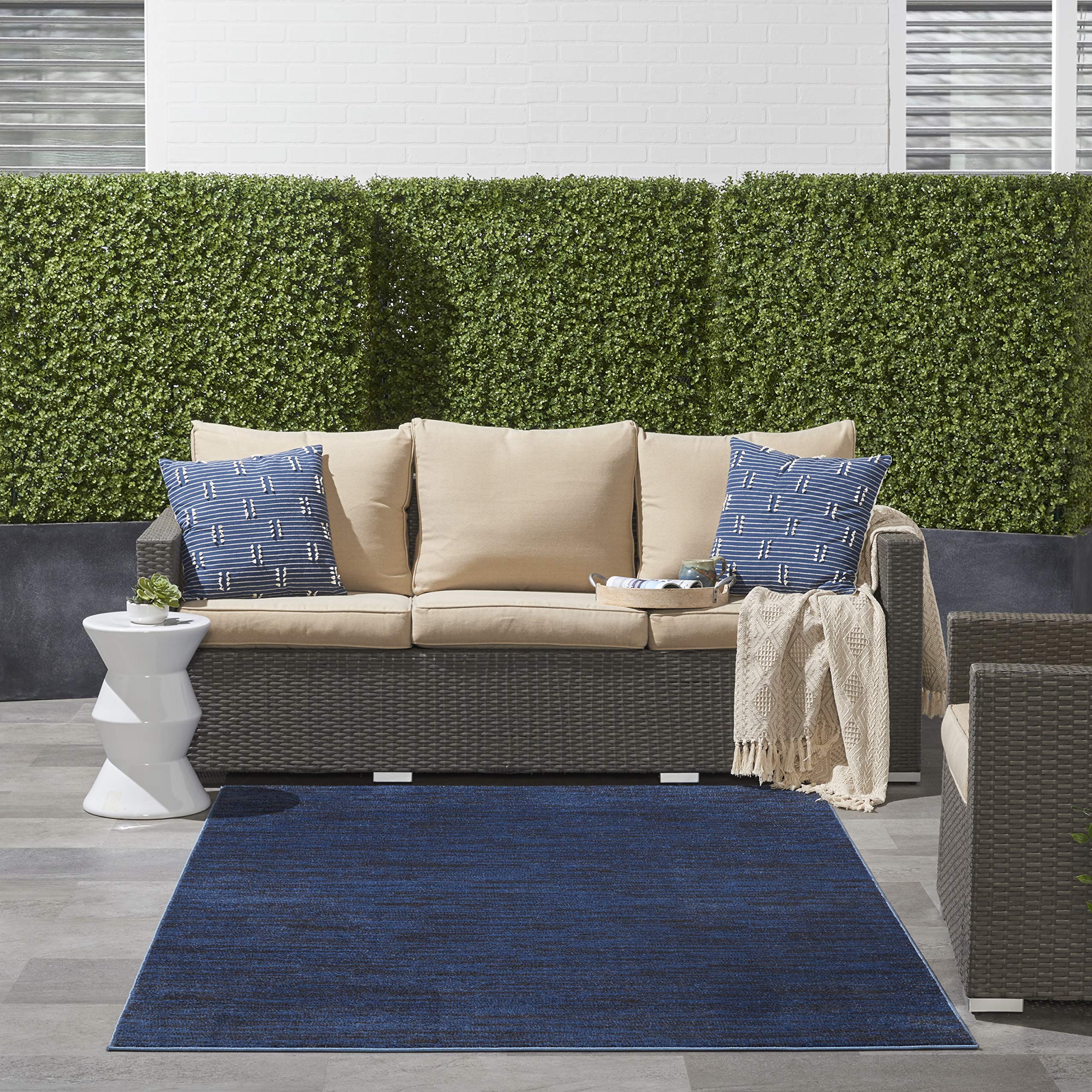 Nourison Essentials Midnight Blue rug in a living room layout