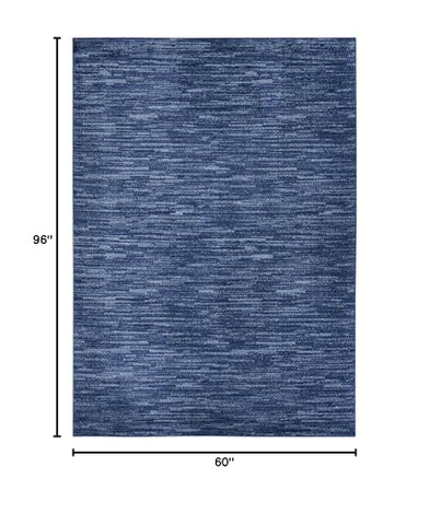 Nourison Essentials navy blue 5x8 rug easy-clean closeup showing fibers