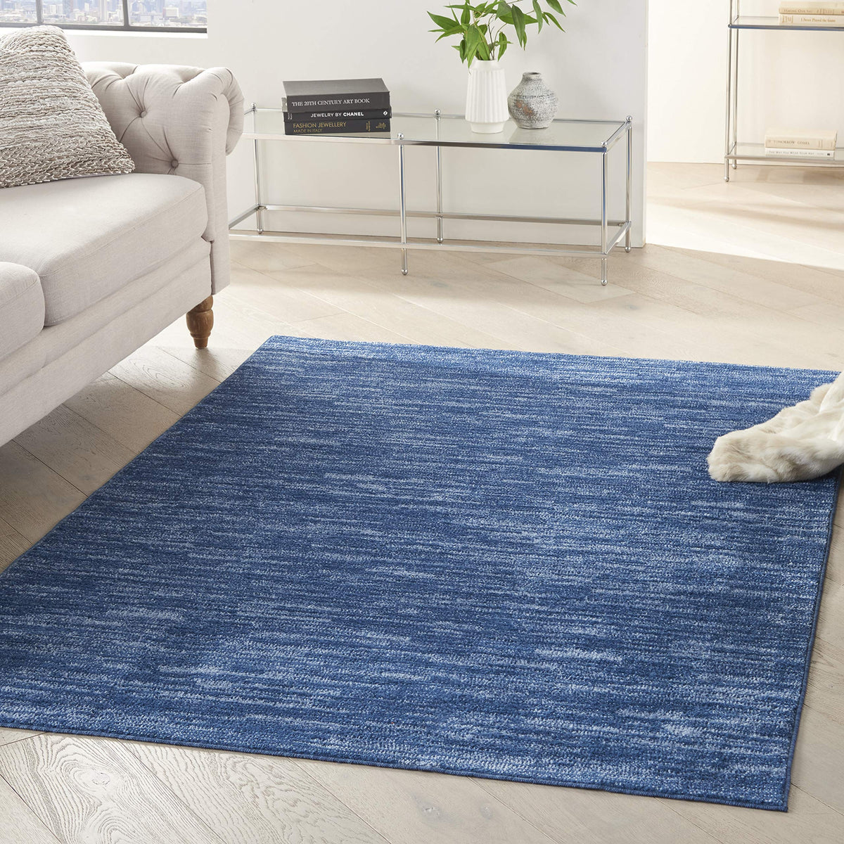 Nourison Essentials navy blue rug 6x9 shows solid color for versatile room styling