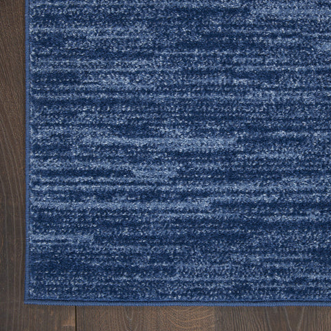 Nourison Essentials navy blue rug easy cleaning with vacuum or hose rinse