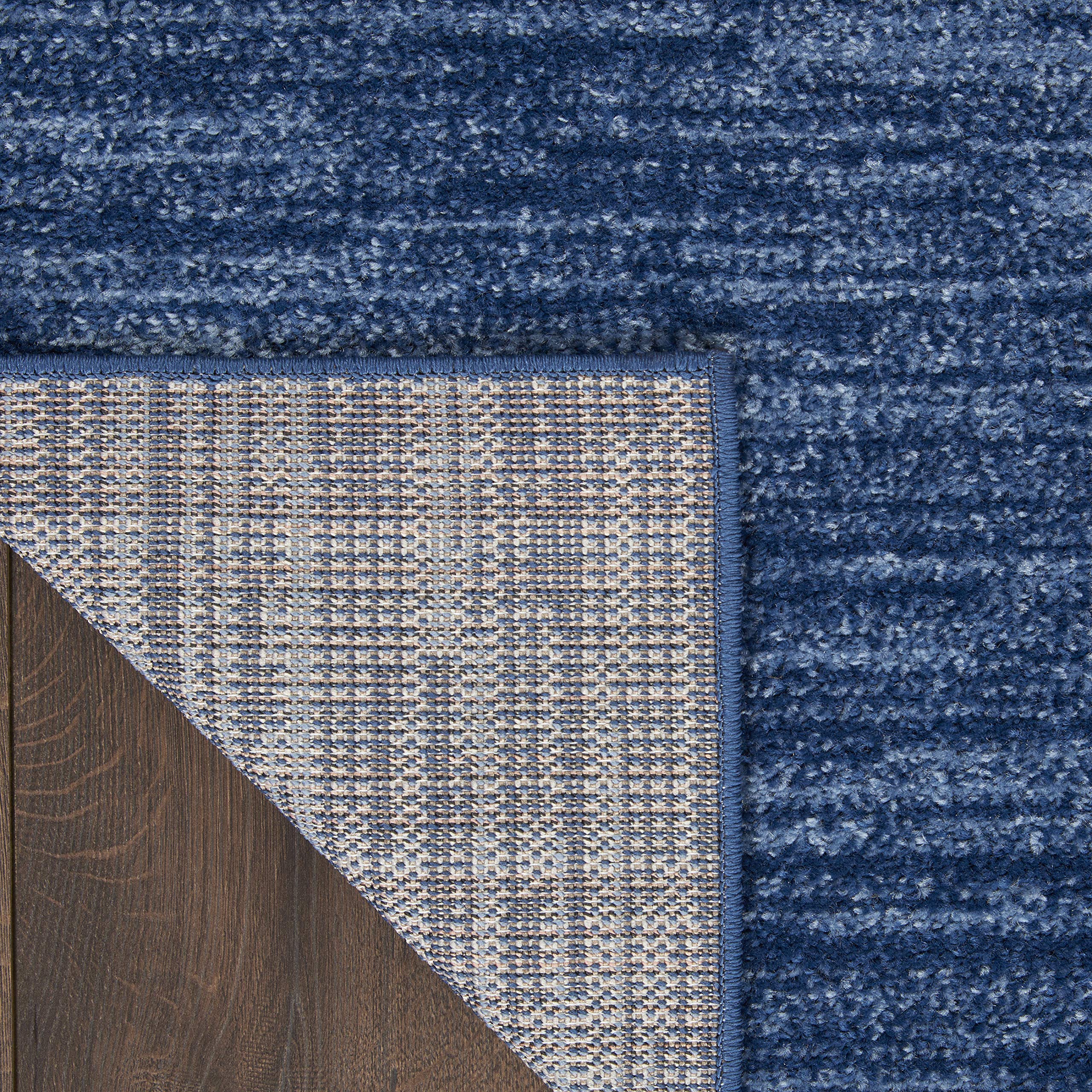 Nourison Essentials navy blue rug designed for indoor and outdoor spaces