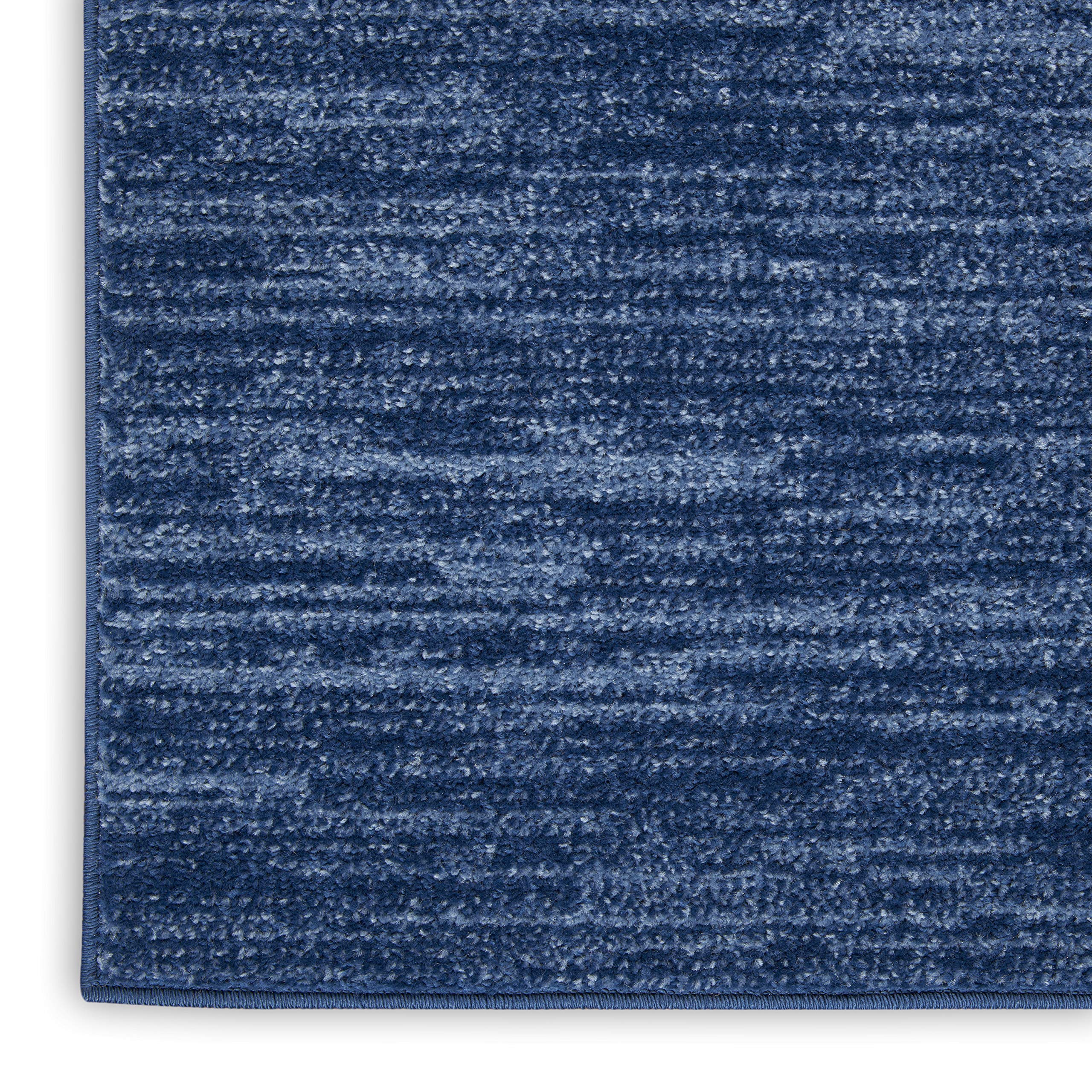 Nourison Essentials navy blue rug 6x9 in living room setting