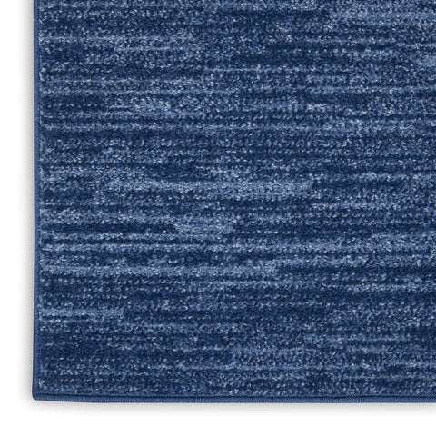 Nourison Essentials navy blue rug 6x9 in living room setting