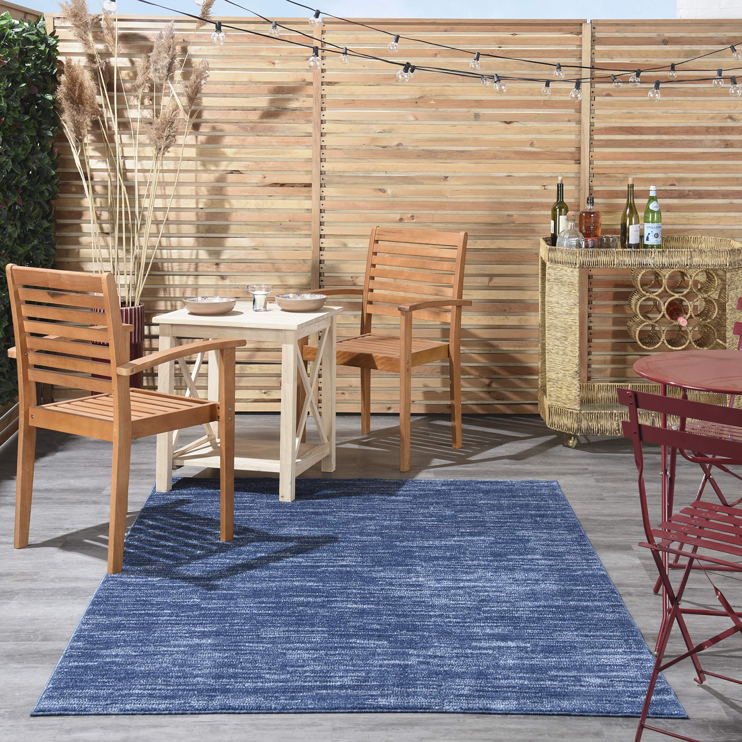 Nourison Essentials navy blue rug serged edge adds durability