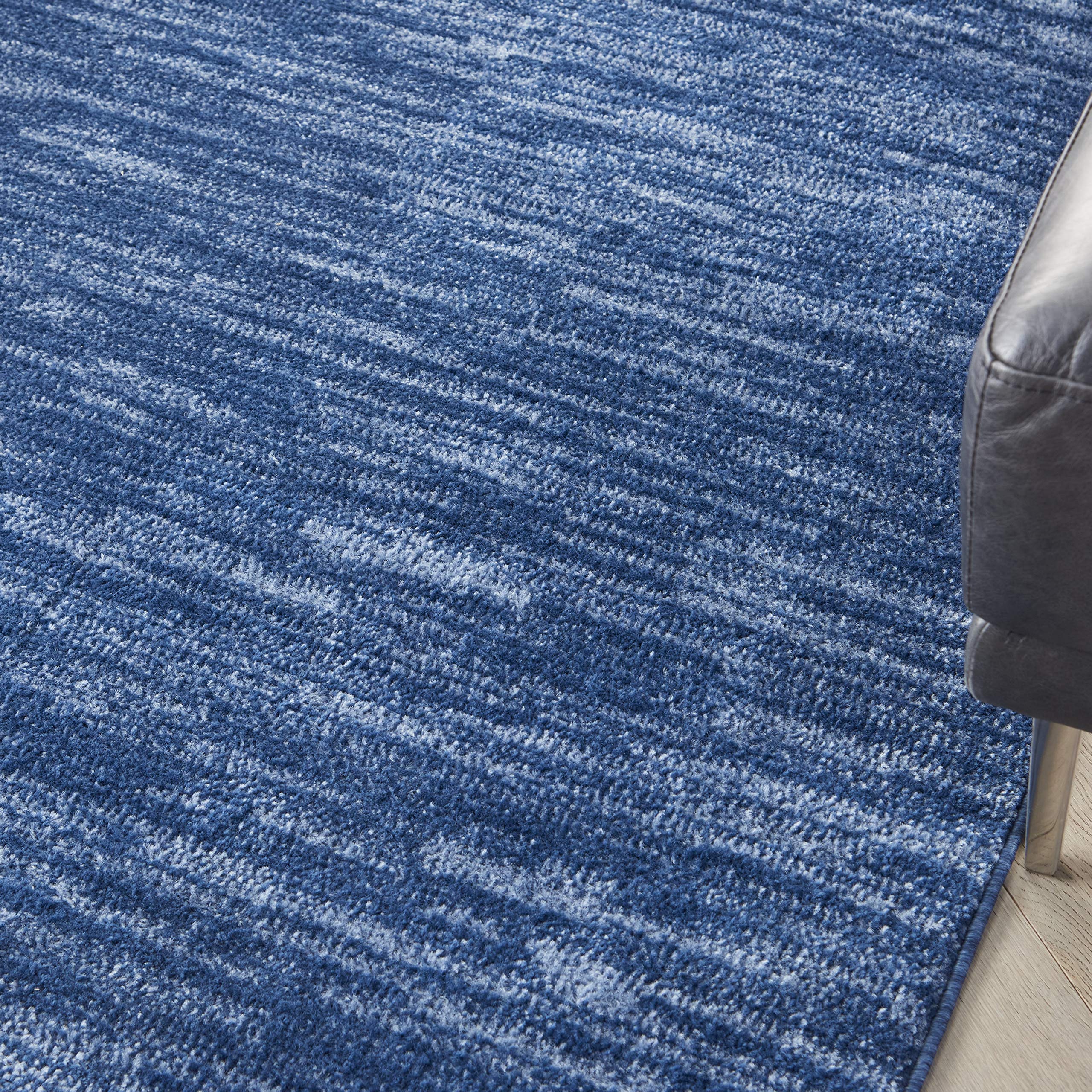 Nourison Essentials navy blue rug close-up highlights soft texture underfoot