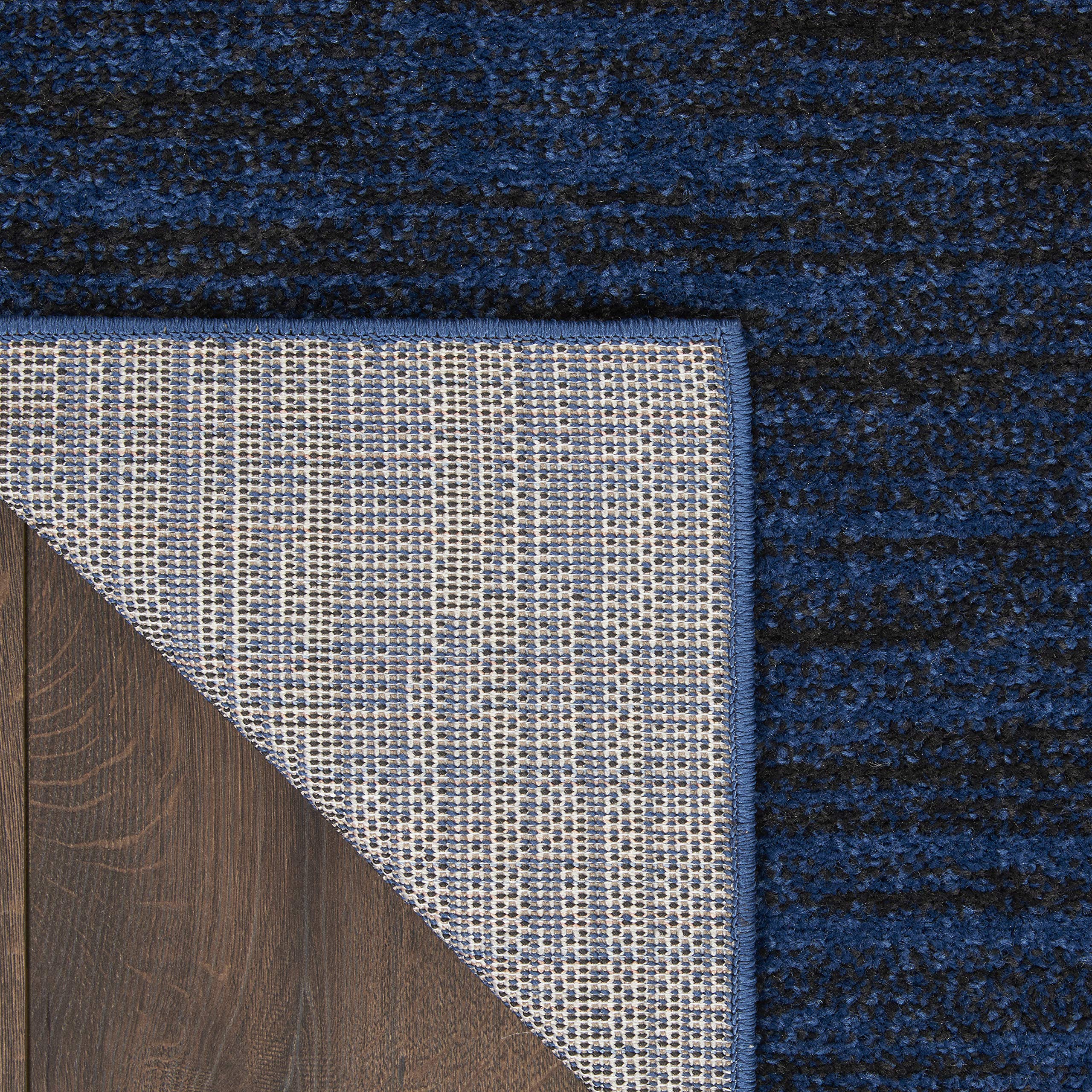 Nourison Essentials Midnight Blue rug on a patio setup