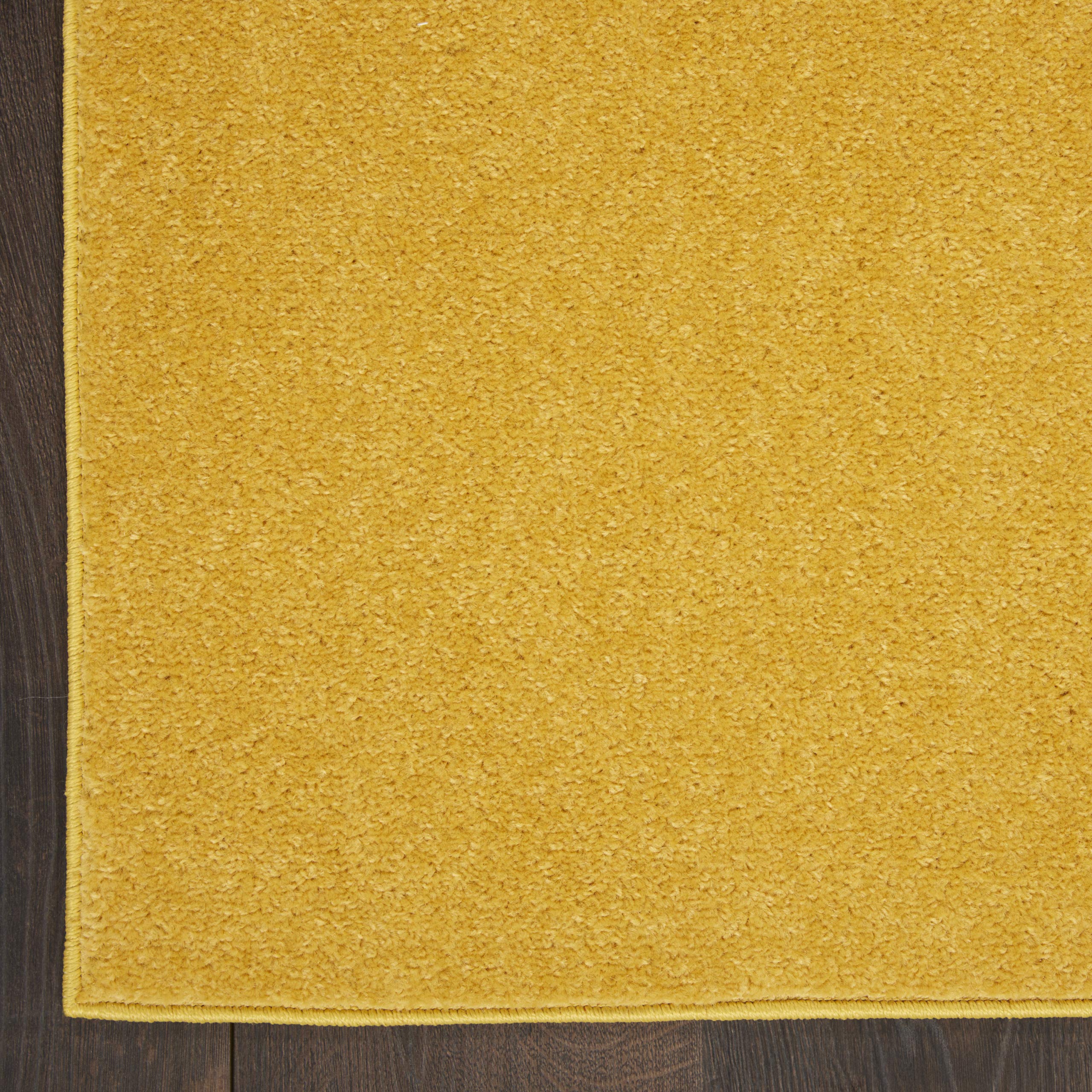 Nourison Essentials Yellow 2x6 runner low pile lays flat under furniture