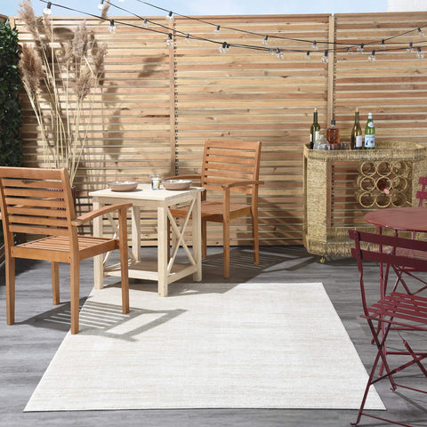 Nourison Home Essentials ivory-beige rug in living room complements modern décor.
