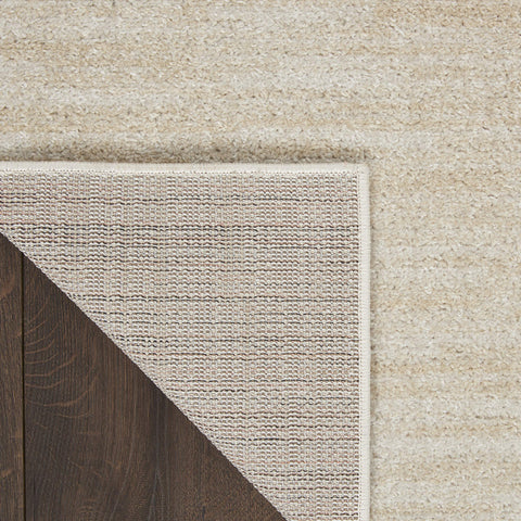 Nourison Home Essentials ivory-beige rug patio setting ready for outdoor gatherings.