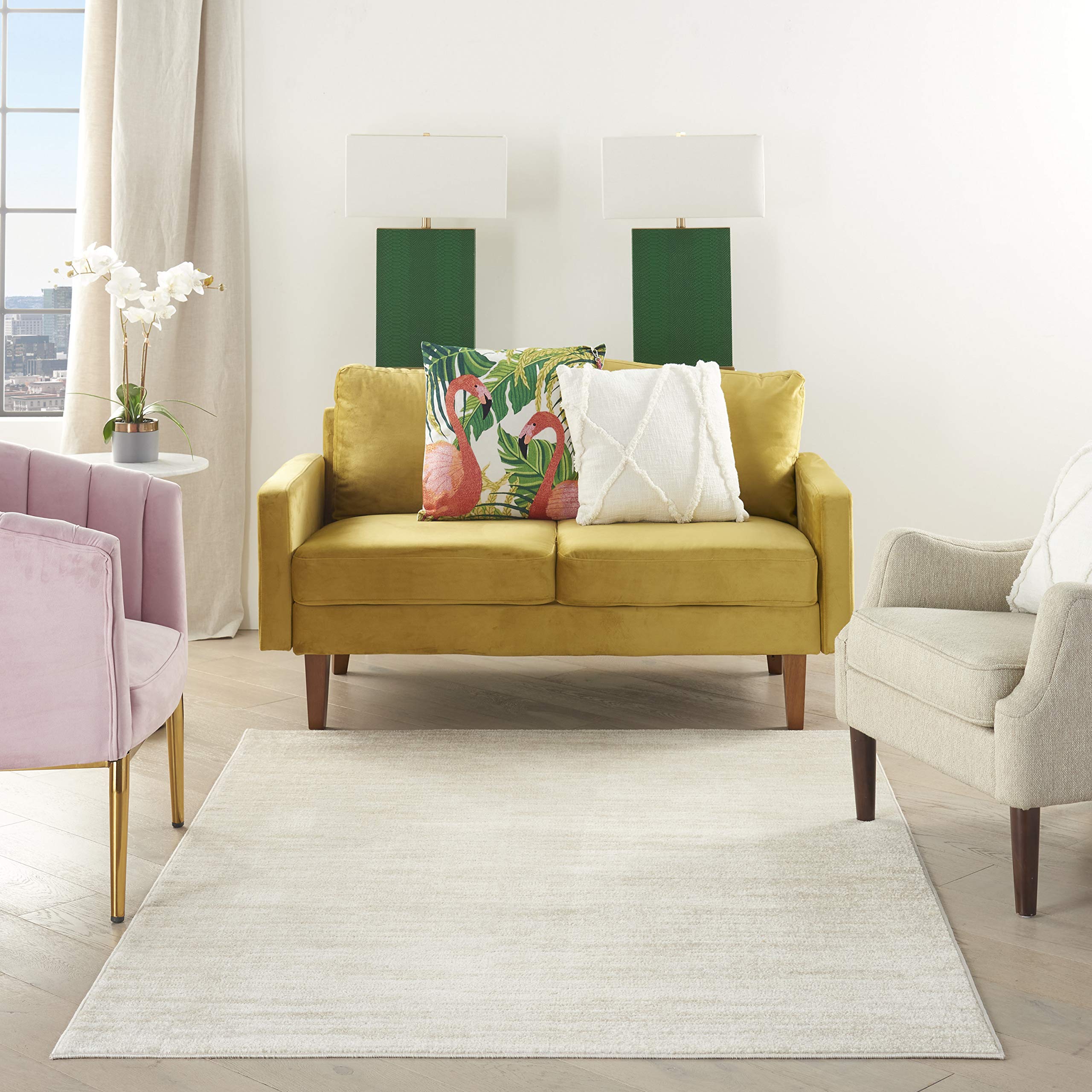Nourison Home Essentials ivory-beige rug on porch scene highlights easy care.