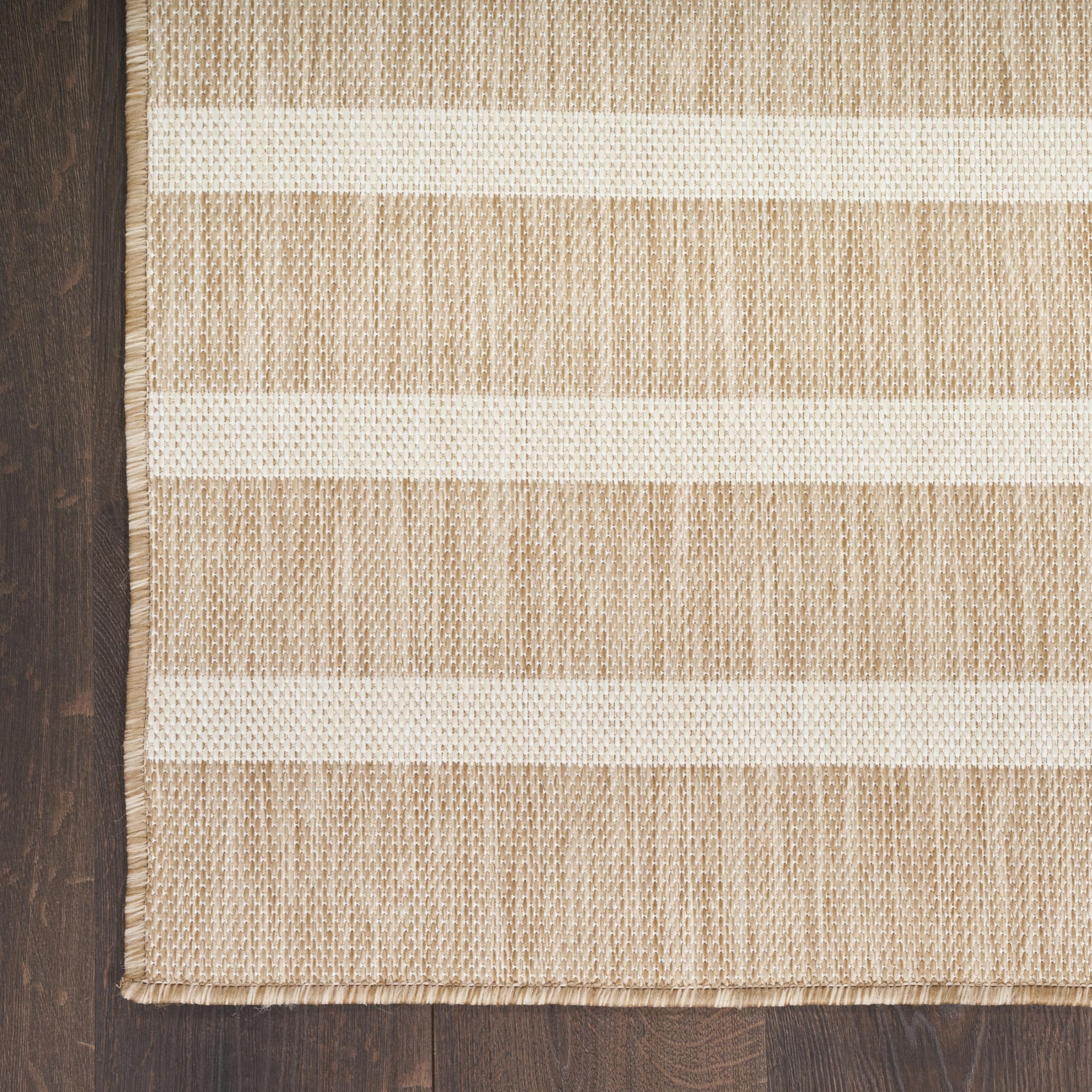 Nourison Positano beige ivory rug space-dyed yarns add color variation.