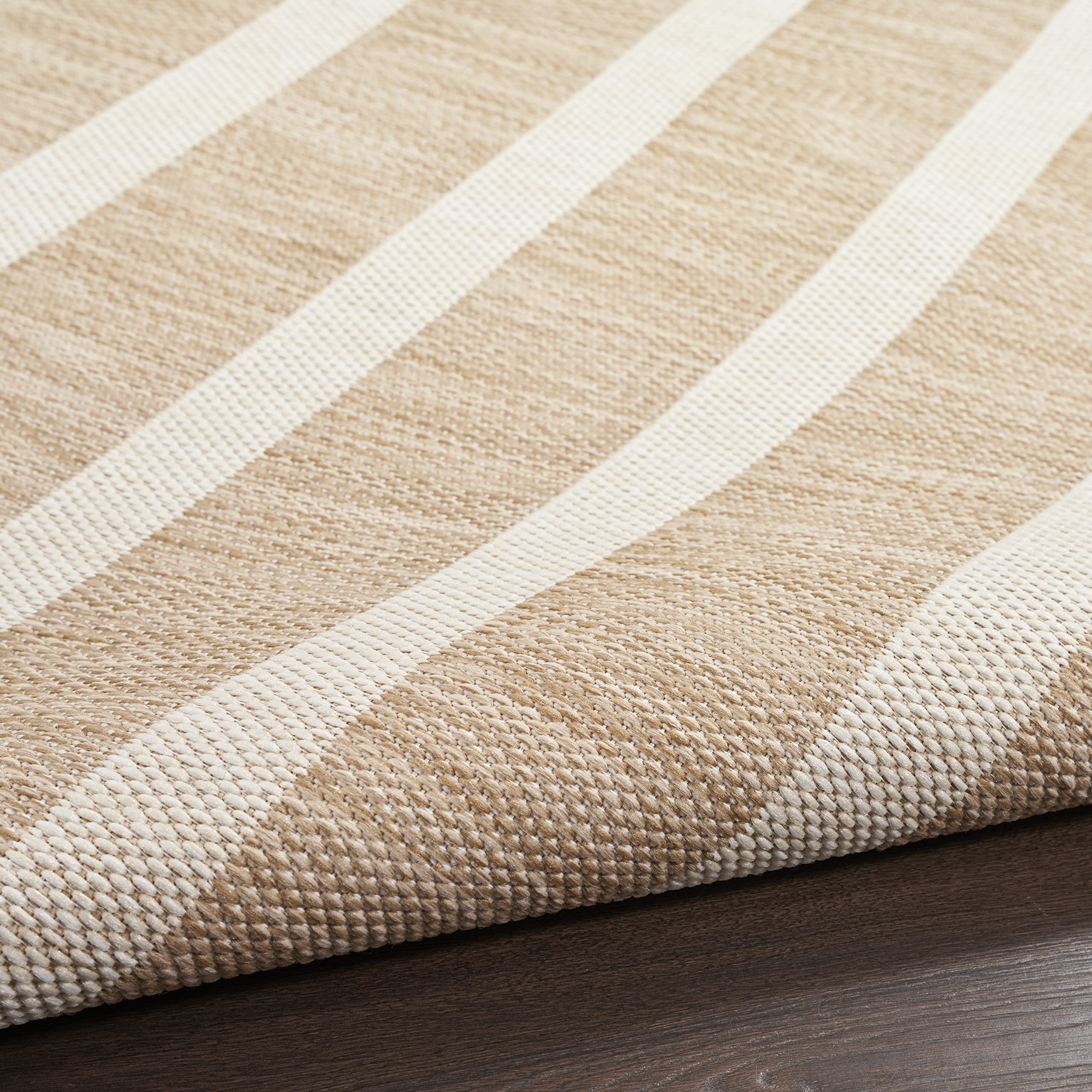 Nourison Positano beige ivory rug with color variation from space-dyed yarns.