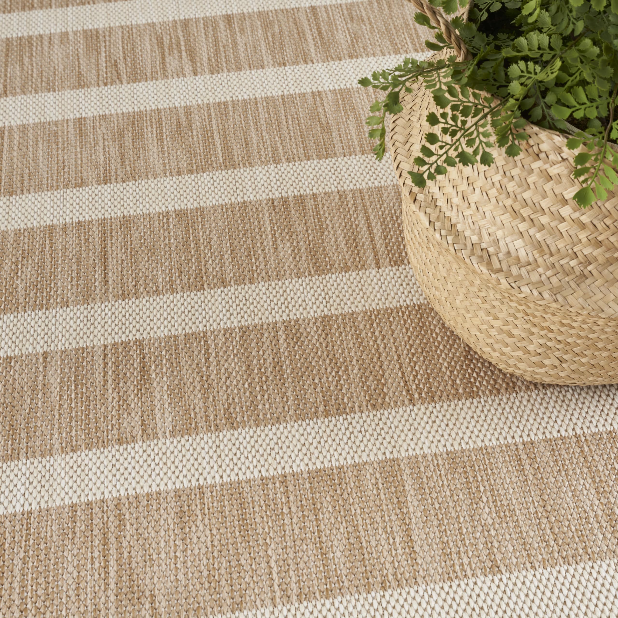 Nourison Positano lightweight rug shown in a versatile room setup.