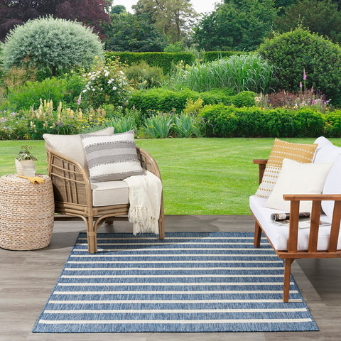 Nourison Positano navy ivory lightweight rug for easy placement.