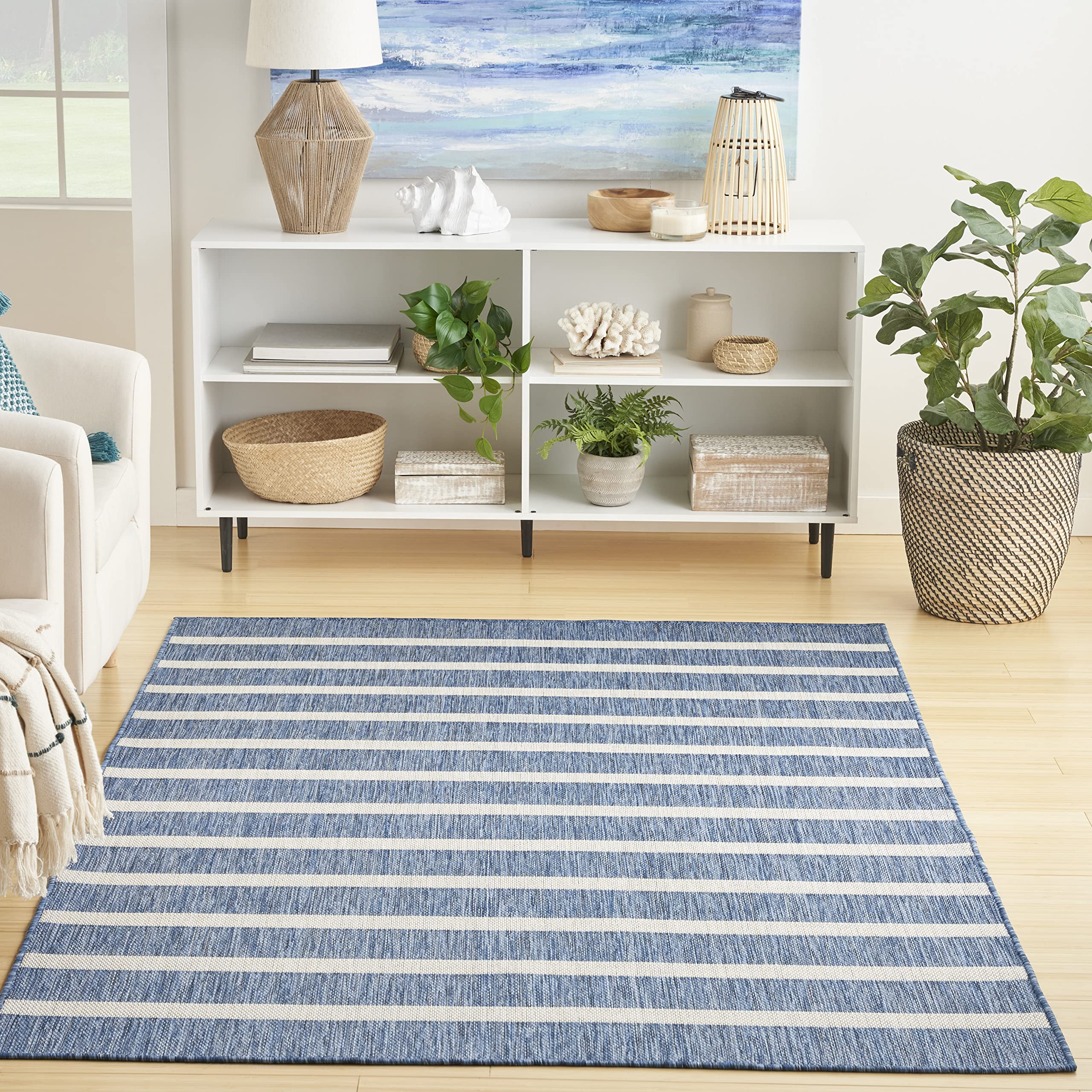 Nourison Positano navy ivory rug with stripes enhances outdoor patio decor.