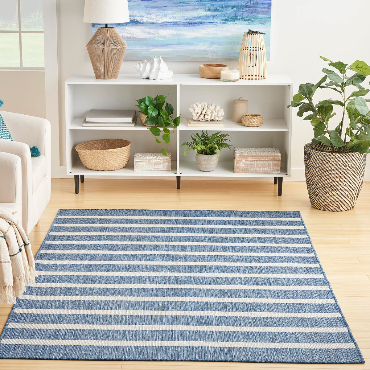 Nourison Positano navy ivory rug with stripes enhances outdoor patio decor.