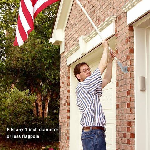 NQ heavy-duty aluminum bracket securing a flagpole outdoors