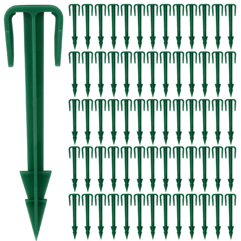 Nuanchu biodegradable green stakes for landscape fabric installation.