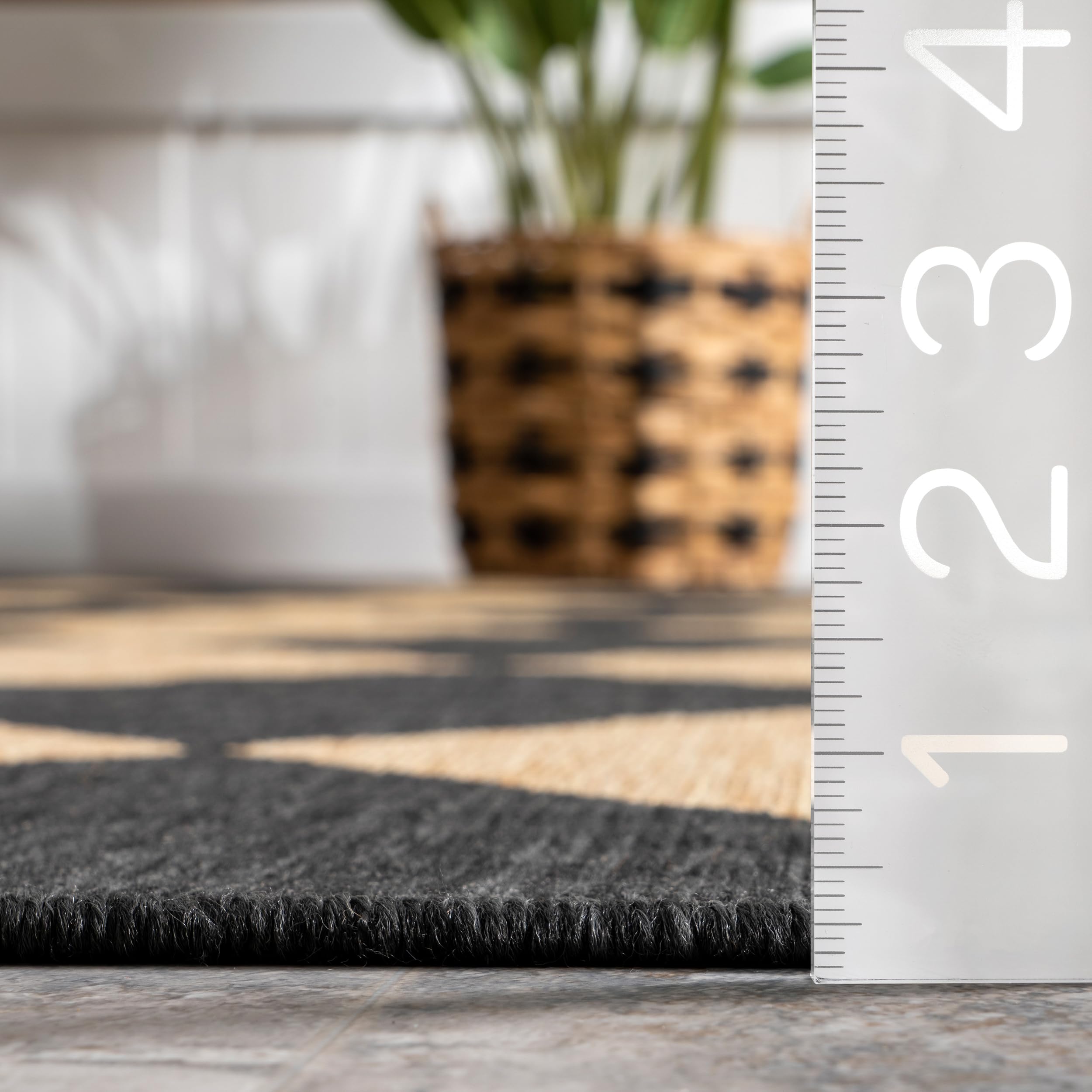 Dark grey and ivory Sabina rug complements patios, decks, and living areas