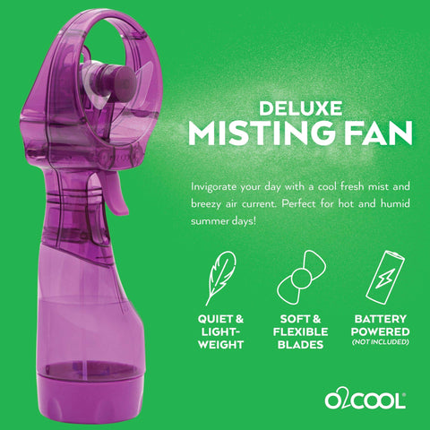 O2COOL Deluxe handheld misting fan in beach-use scene cooling by the shore.