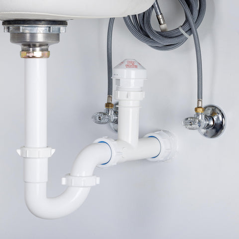 Oatey Sure-Vent valve in DWV system blocks sewer gases via pressure-aware venting