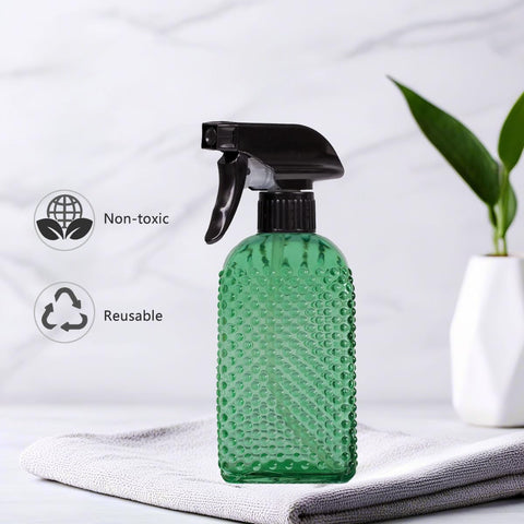 OEXEO glass spray bottle designed for window and table cleaning.