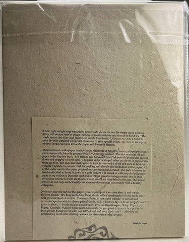 Close-up of embedded wildflower seeds in Of The Earth Lotka paper