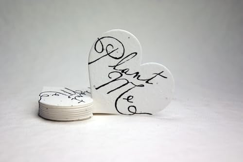 Of The Earth seed paper heart tag die-cut closeup, showing handmade detail and plantable surface