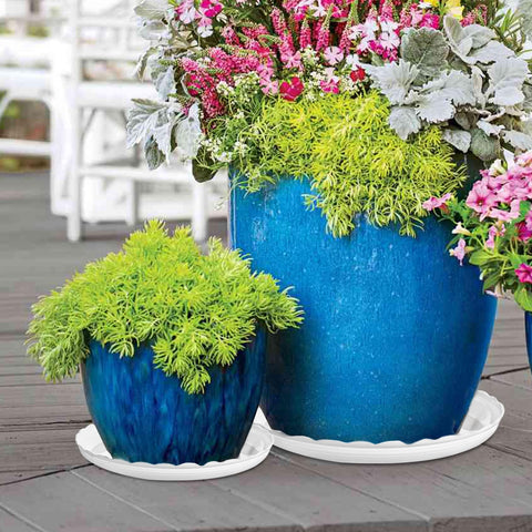 OFiSEXPT wave-pattern decor saucer blends with decor while protecting surfaces.