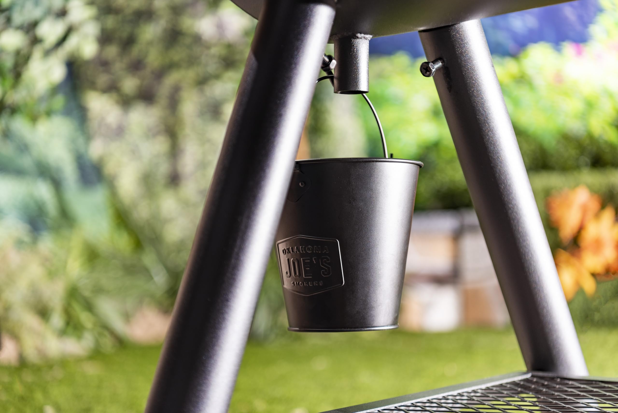 Oklahoma Joe's black drip bucket keeps your grilling area neat and organized.