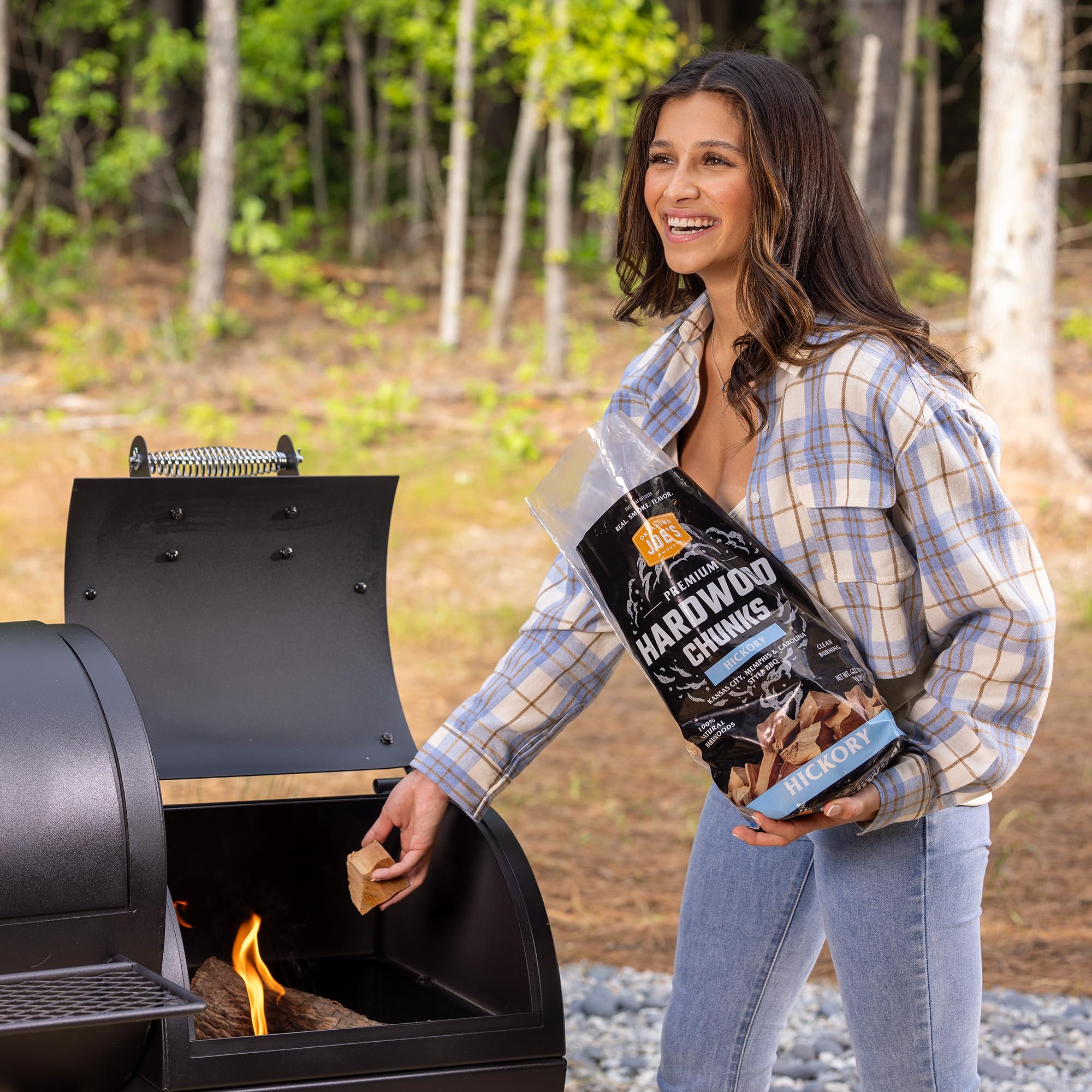 Oklahoma Joe's Hickory wood chunks in premium bag for clean, even burn.