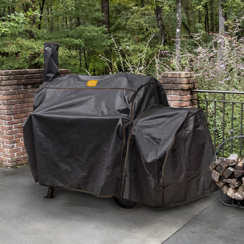 Oklahoma Joe's Highland Offset Smoker Cover with secure straps maintains a snug fit.