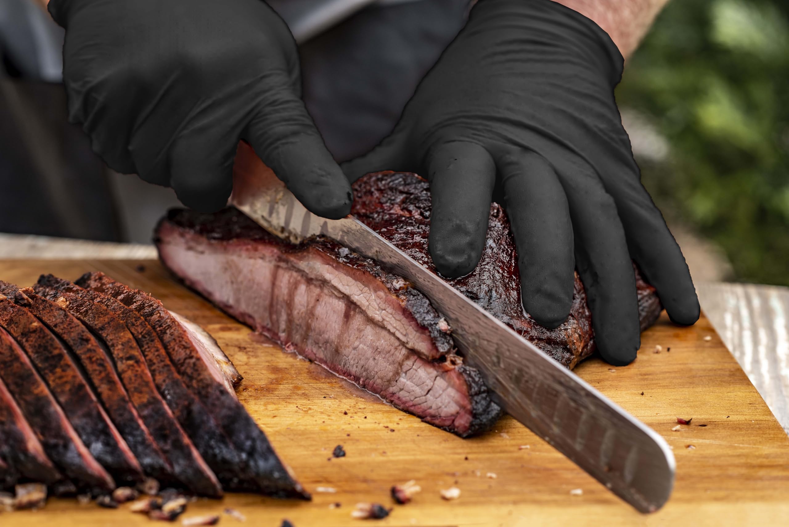 Oklahoma Joe's liners placed under nitrile gloves for hot handling.