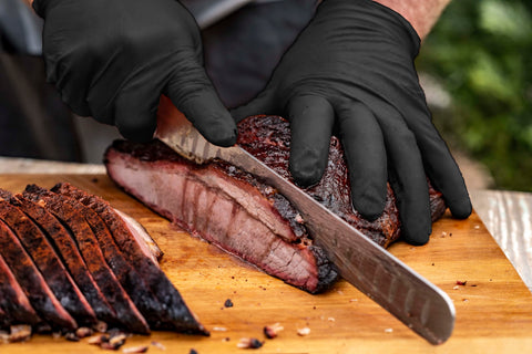 Oklahoma Joe's liners placed under nitrile gloves for hot handling.