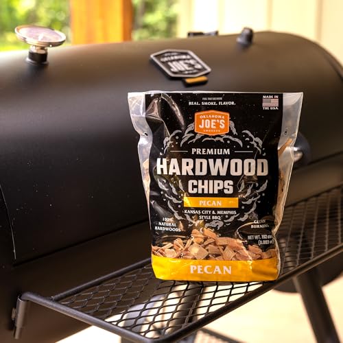 Oklahoma Joe's pecan wood chips on a grill for versatile smoke setup