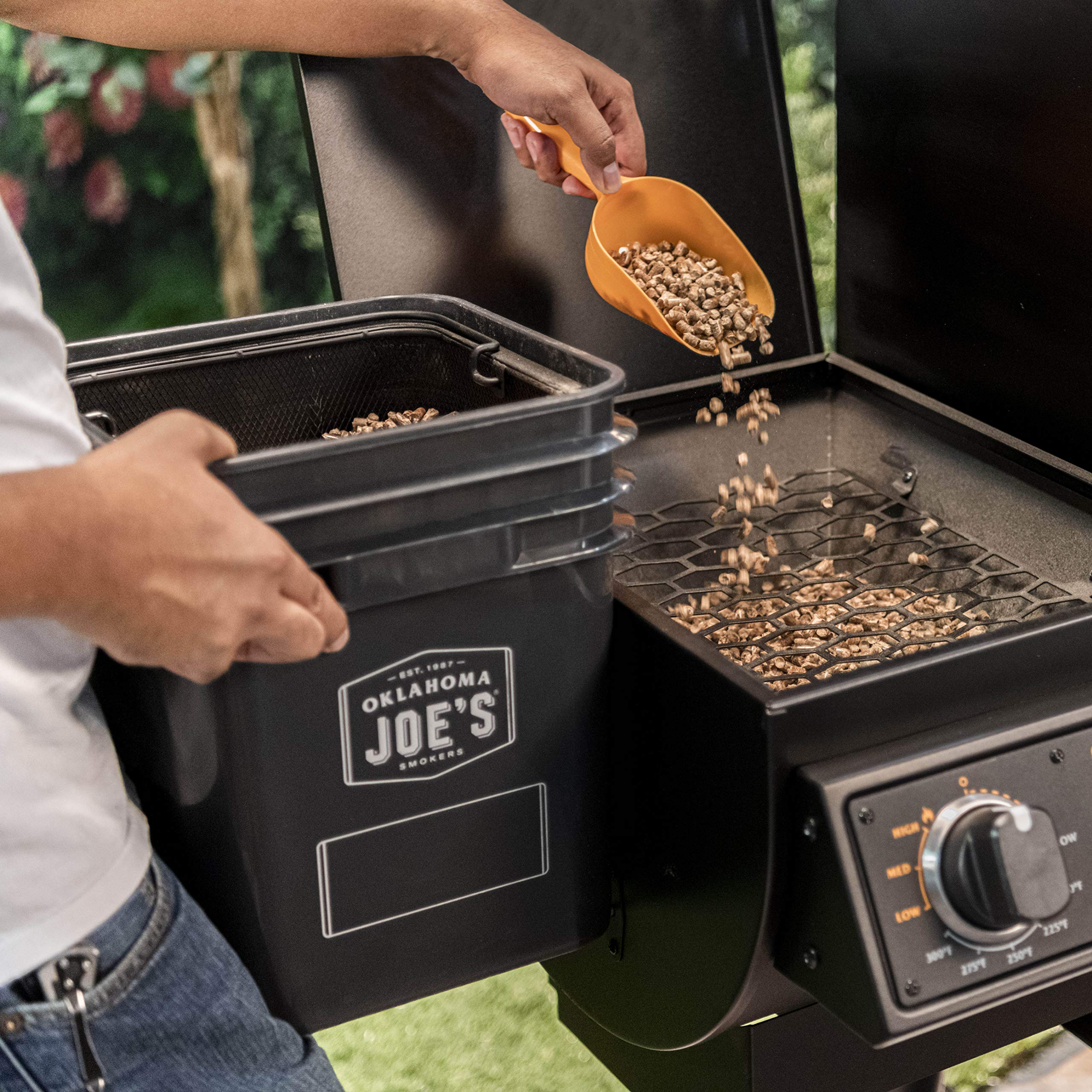 Oklahoma Joe's pellet bucket lid with weatherproof seal protects pellets.
