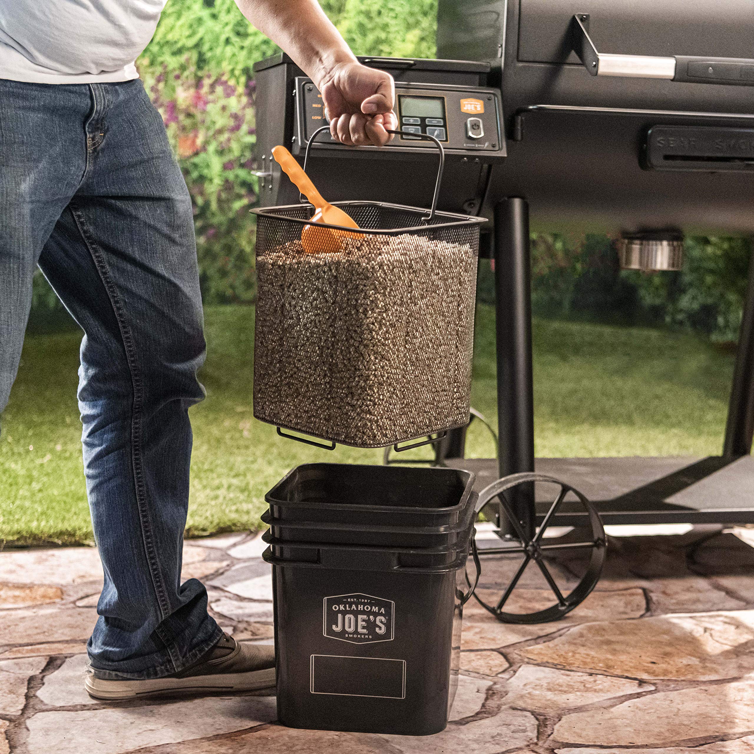 Oklahoma Joe's wire-mesh filter removes wood dust for a cleaner burn.