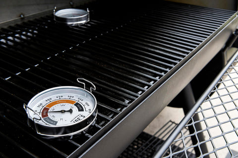 Oklahoma Joe's two gauges showing temperature markings for cooking styles