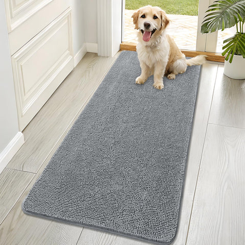 OLANLY dog door mat shows muddy paws and absorbed moisture at the threshold, keeping entry clean.