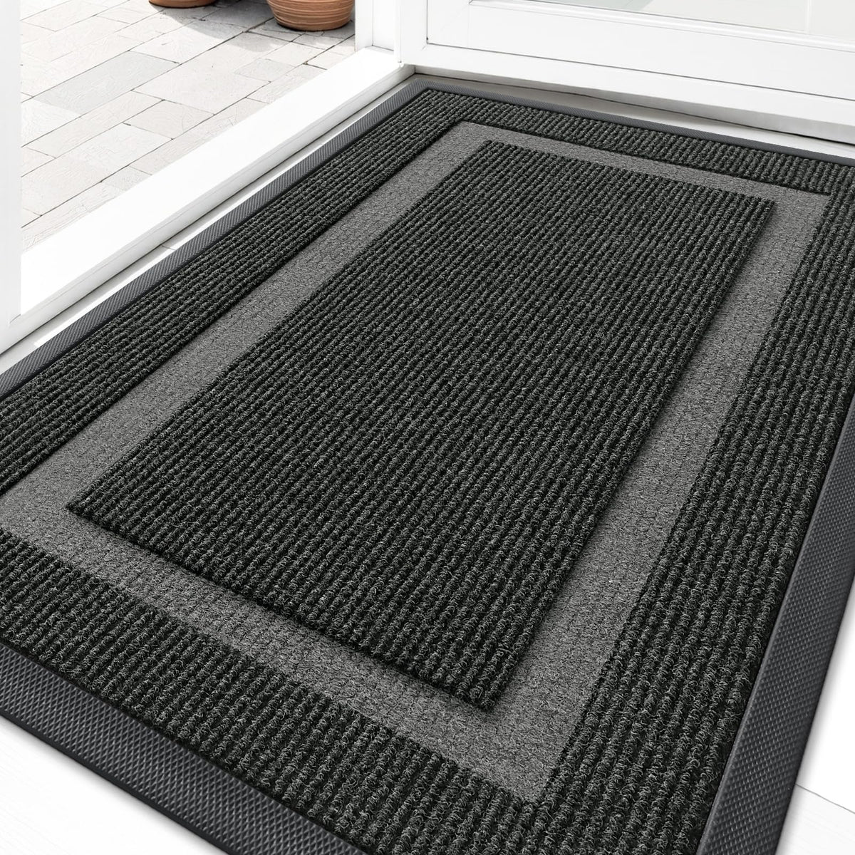 OLANLY front door mat with rubber back glides under doors and traps dirt