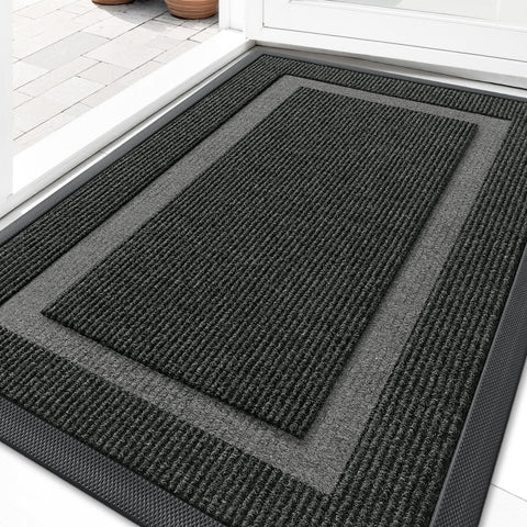 OLANLY front door mat with rubber back glides under doors and traps dirt