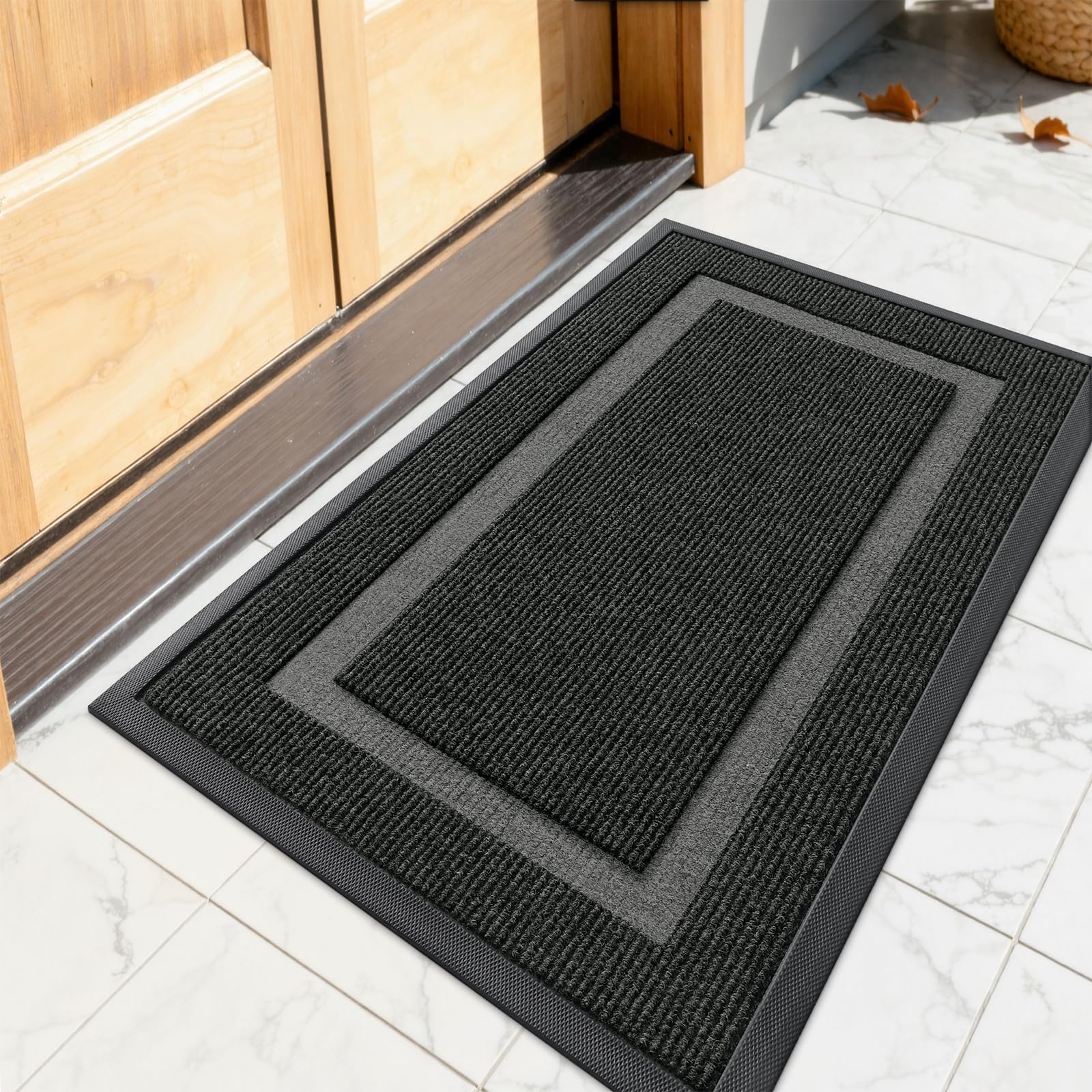 OLANLY front door mat shows rugged rubber backing that traps dirt effectively.