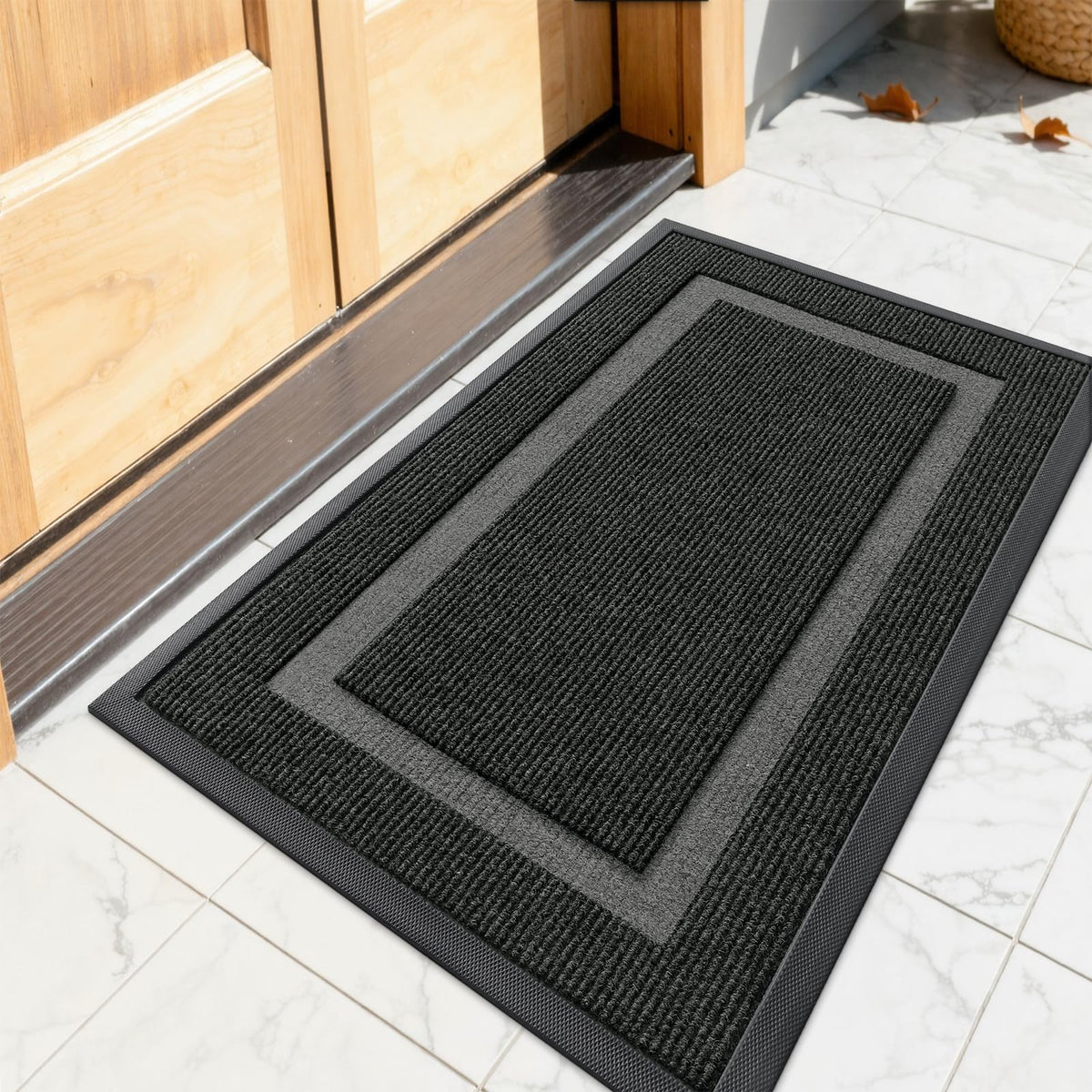 OLANLY front door mat shows rugged rubber backing that traps dirt effectively.