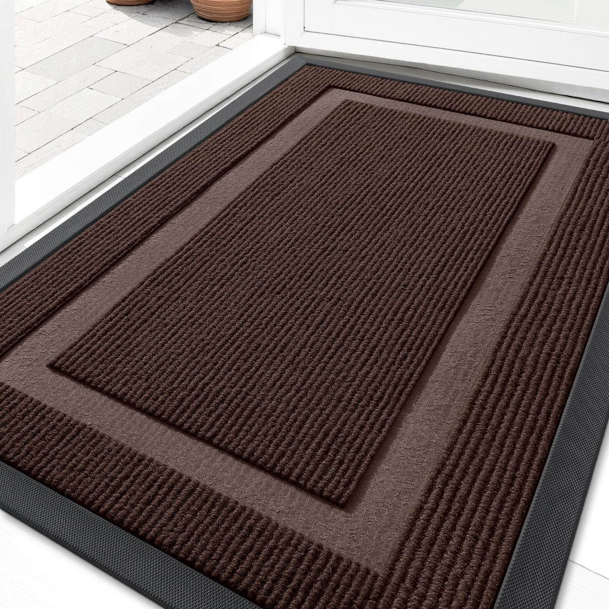OLANLY front door mat with rubber backing reduces wear and keeps entry tidy.