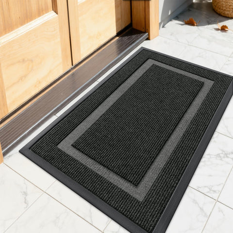 OLANLY front door mat shows rugged rubber backing that traps dirt effectively.
